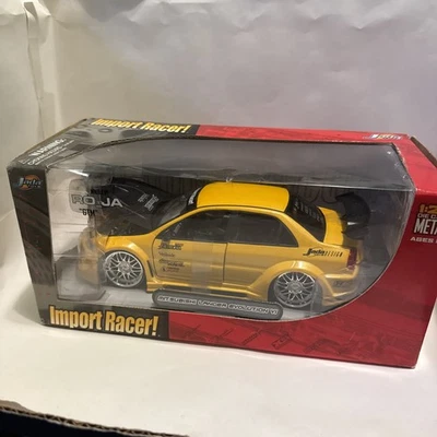 Mitsubishi Lancer Evolution VI amarillo escala 1:24 diecast Jada Foto 1 de 4