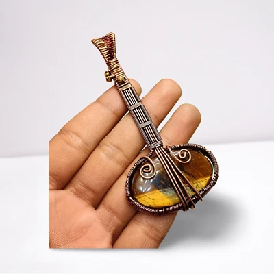 Colgante de guitarra Music Love ojo de tigre piedras preciosas envoltura de alambre de cobre joyería hecha a mano Foto 1 de 4