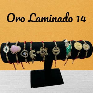 Pulcera de Hilo Rojo y Oro Laminado 14 son Diferentes Dijes para Protección - Imagen 1 de 11