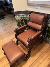 Horner Brothers brown leather Gentleman's chair and matching ottoman c 1885