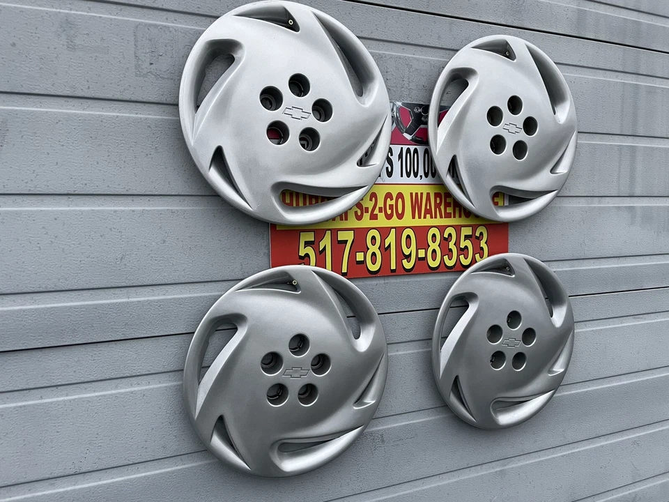 "Chevrolet Cavalier 1992-94 tapacubos originales atornillados, como nuevo usado" Juego 4 Bonito Foto 1 de 4