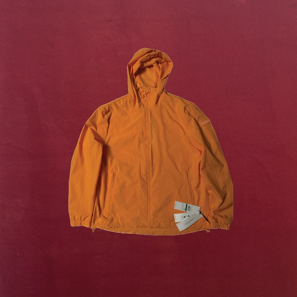 CHAQUETA DE LLUVIA CON CAPUCHA CALVIN KLEIN GRANDE, NUEVA CON ETIQUETAS, UNISEX NARANJA AMARILLO MODELO CM355105 Foto 1 de 1