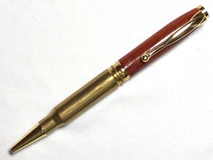 Bolígrafo calibre 308 hecho con madera de sangre y una carcasa de latón genuino. go - Imagen 1 de 4