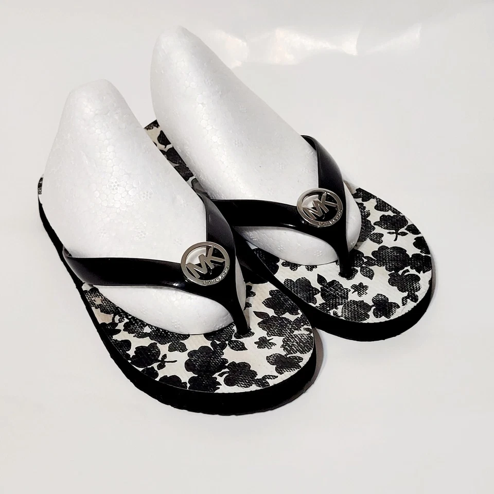 MICHAEL KORS Flip Flop Black White Floral Jet Set Silver Logo Medallion Wms 6M - Image 1 of 4