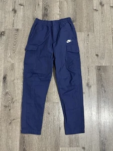 Pantalones cargo Nike utilitarios sin forro para hombre pequeños azules tejidos elásticos en la cintura bolsillos - Imagen 1 de 13