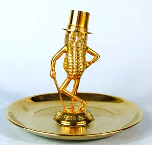 CENICERO PUBLICITARIO VINTAGE PLANTERS PEANUTS MR. PEANUT METAL DORADO TUERCA 1956 - Imagen 1 de 10