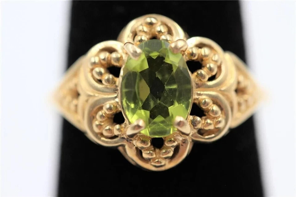 Anillo de compromiso de peridoto creado en laboratorio ovalado de 2 quilates con caña de diseñador de oro amarillo de 14 quilates Foto 1 de 3
