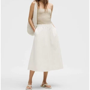 NEW Lululemon Stretch Woven Ruffle-Waist Midi Skirt Light Ivory Women's L - Picture 1 of 4