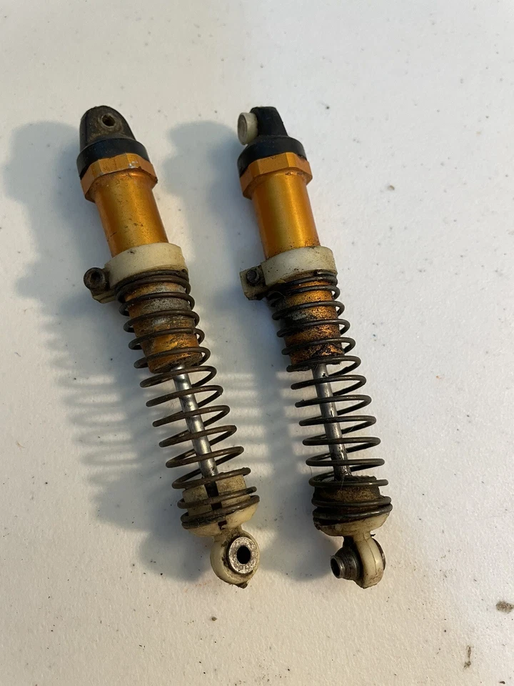 RC10 6010 Gold TEAM ASSOCIATED VINTAGE RC10 BUGGY Rear SHOCKS - Image 1 of 2