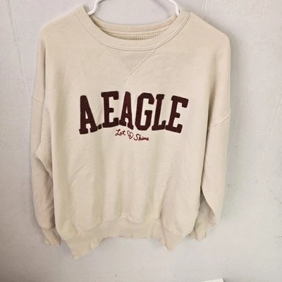 Sudadera American Eagle Crema Talla XSpequeña Cuello Redondo Boxy Let Love Shine U0436 Foto 1 de 4