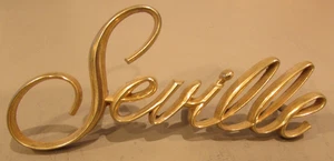 1975-79 Cadillac Seville Gold Fender Script Emblem 1608846 - Picture 1 of 3