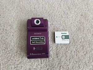 Sony Webbie HD MHS-PM1 5,0 megapixel fotocamera viola con batteria testata e funzionante - Foto 1 di 10