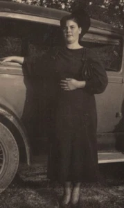 1940s Woman Posing Classic Car Stylish Outfit Confident Stance Portrait - Picture 1 of 3