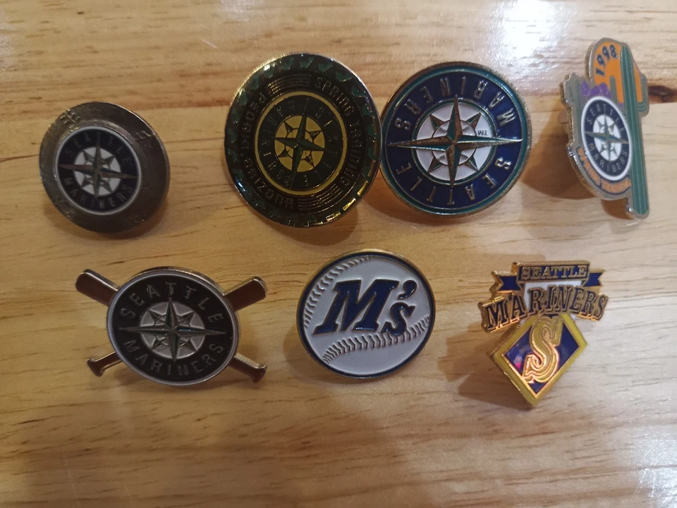 Seattle Mariners Spring Training & Past Logos MLB Baseball 7 Pin Set - Image 1 of 1