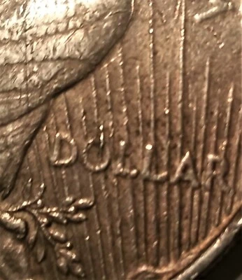 1924 Peace Dollar -  Die Error - "Broken Ray" appearance / Cud over the O - Image 1 of 4