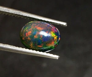 Natural Ethiopian Opal Cabochon Oval Shape 1.55 Cts Multi Fire Black Opal jewels - Picture 1 of 6