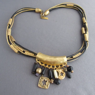 LONNIE LOVNESS MULTI LEATHER STRAND RETRO GOLD TONE TASSEL PENDANT NECKLACE - Image 1 of 4