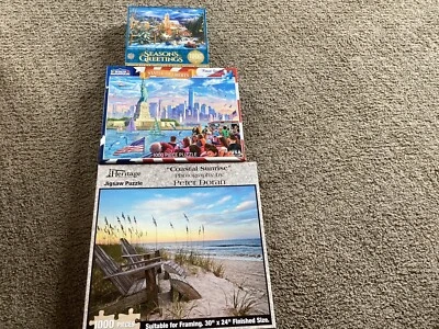 Grupo de 3 1000 piezas rompecabezas Estatua de la Libertad, saludos de estaciones, amanecer costero Foto 1 de 4