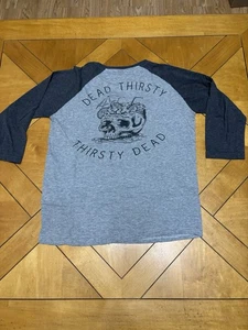 T-shirt raglan cotone su novanta uno piccola grafica teschio morto assetato - Foto 1 di 3