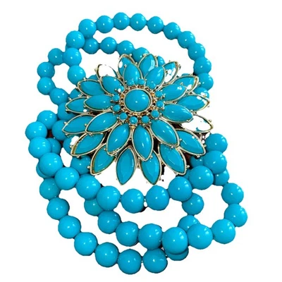 Pulsera elástica flor azul turquesa tono dorado joyería distintiva Foto 1 de 4