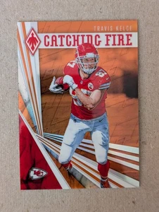 2019 Panini Phoenix - Catching Fire Travis Kelce #15 Orange /99 - Bild 1 von 3