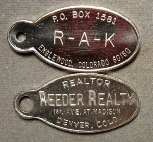 8849 2-CO Key Tags: Englewood, R-A-K + Denver, Reeder Realty. Copper nickel, 42m - Picture 1 of 2