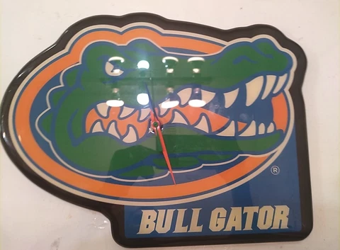 Vintage UF Gators Clock. Aprox 14 X 10. working, but hands a bit bended Cover