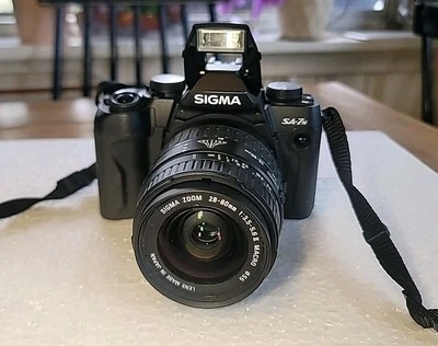 Sigma SA-7N SLR Film Camera with 28-80mm Lens and lens,no Battery's  - Image 1 of 4
