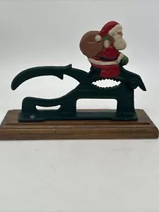 Vintage Black Cast Iron Nutcracker Red wooden base Santa Clause & Toy Bag - Picture 1 of 4