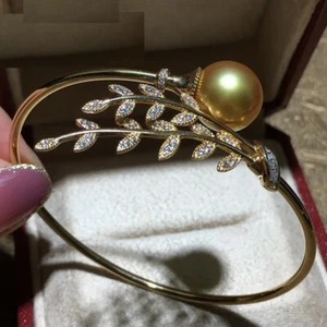 Wunderschönes riesiges AAA 10-11mm Südsee goldenes rundes Perlenarmband 925er - Bild 1 von 3