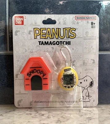 PEANUTS TAMAGOTCHI Nano Digital Pet  Silicone Case  75th Anniversary  NEW - Image 1 of 4