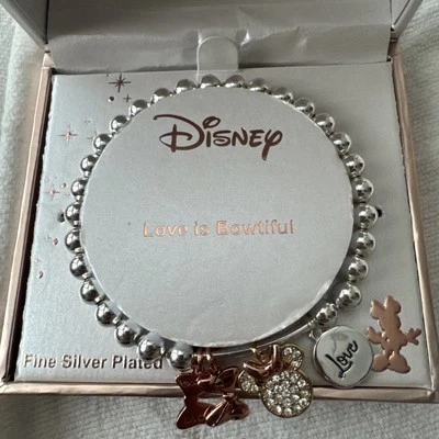 Pulsera elástica Disney Minnie Mouse Love is Bowtiful fina plateada con dijes Foto 1 de 4