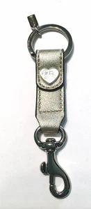 Llavero Coach de cuero dorado con logotipo en tono plateado anillo llavero nuevo con bolsa - Imagen 1 de 3