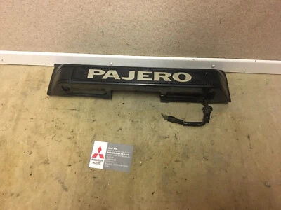 MITSUBISHI SHOGUN PAJERO REAR NUMBER PLATE LIGHTS AND TRIM  - Image 1 of 4