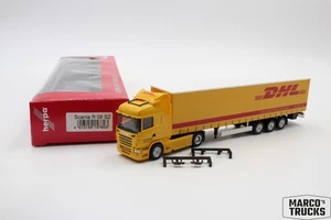 Herpa Scania R09 HL semi-trailer "DHL" 157803 1:87 /H23072 - Picture 1 of 1