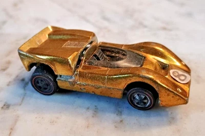 McLaren M6A 1968 Hot Wheels Redline oro amarillo vintage Foto 1 de 4