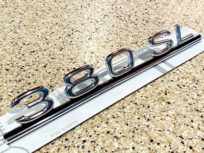 MERCEDES BENZ R107 380SL CUBIERTA TAPA MALETERO EMBLEMA SCRIPT 380SL GENUINO Foto 1 de 4