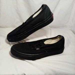 vans black leather slip on perforated