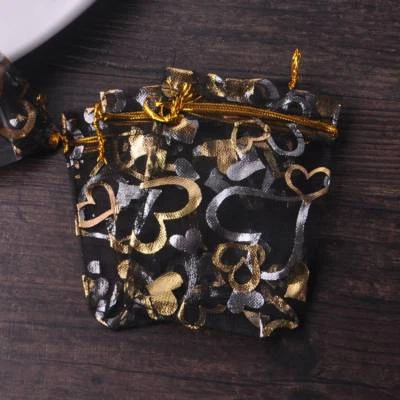 Bolsas de caramelos de organza de gasa transparente con patrón de corazón 100 piezas bolsas de joyería Foto 1 de 2