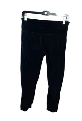 Athleta womens yoga exercise pants size MT black sheer mesh panel at calf area - Image 1 of 4