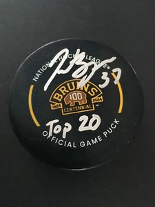 PATRICE BERGERON AUTO'D BOSTON BRUINS CENTENNIAL GM PUCK  "TOP 20" INSCR. C.O.A. - Picture 1 of 7