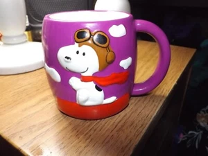Galerie Peanuts Snoopy Red Baron lila Keramik Kaffeebecher 2008 RAR - Bild 1 von 2
