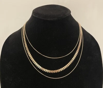 Collar de moda dorado espina de pescado cadena en capas triple hilo de ASOS Foto 1 de 4