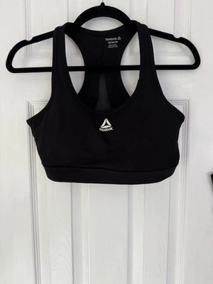 Sujetador deportivo Reebok negro con relleno y diseño de malla en la espalda talla M Foto 1 de 2