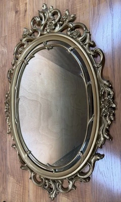 Espejo dorado vintage años 70 Hollywood Regency decoración de pared ornamentado 29 X 18 ovalado estilo siroco Foto 1 de 4