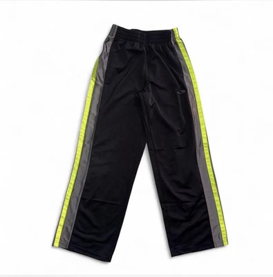 Pantalones deportivos Champion negros con rayas amarillas y blancas talla mediana 8-10 para niños Foto 1 de 4