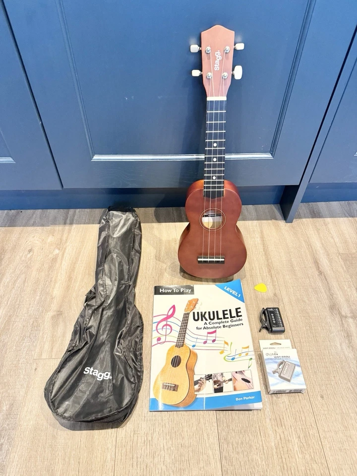 STAGG HAND MADE WOODEN UKULELE CASE,TUNER,BOOK IN EXCELLENT CONDITION - Image 1 of 4