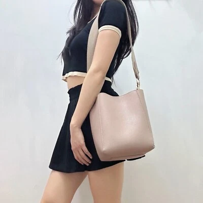 Mauve blush pink bucket bag. Faux leather grain texture. Magnetic snap closure - Image 1 of 4