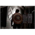Chris Evans as Captain America in front of S.H.I.E.L.D. logo 8 x 10 Inch Photo