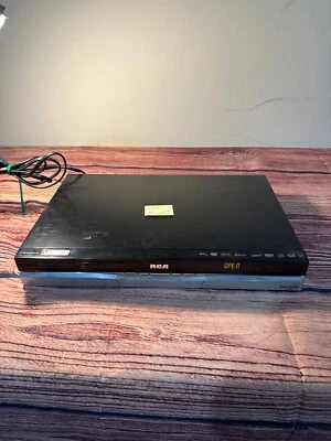 RCA DRC8052N - READ - DVD Player RW Recorder Coax/RCA/S Video HDMI - POWERS ON - Image 1 of 4